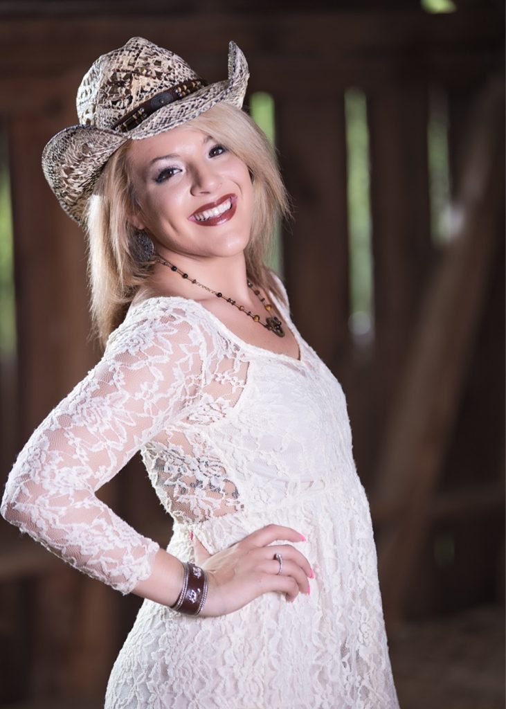 Senior-Posing-for-her-portrait-with-G-and-E-Studios