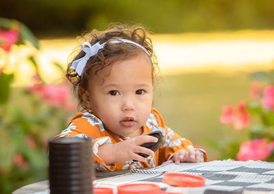 Little girl playing checkers