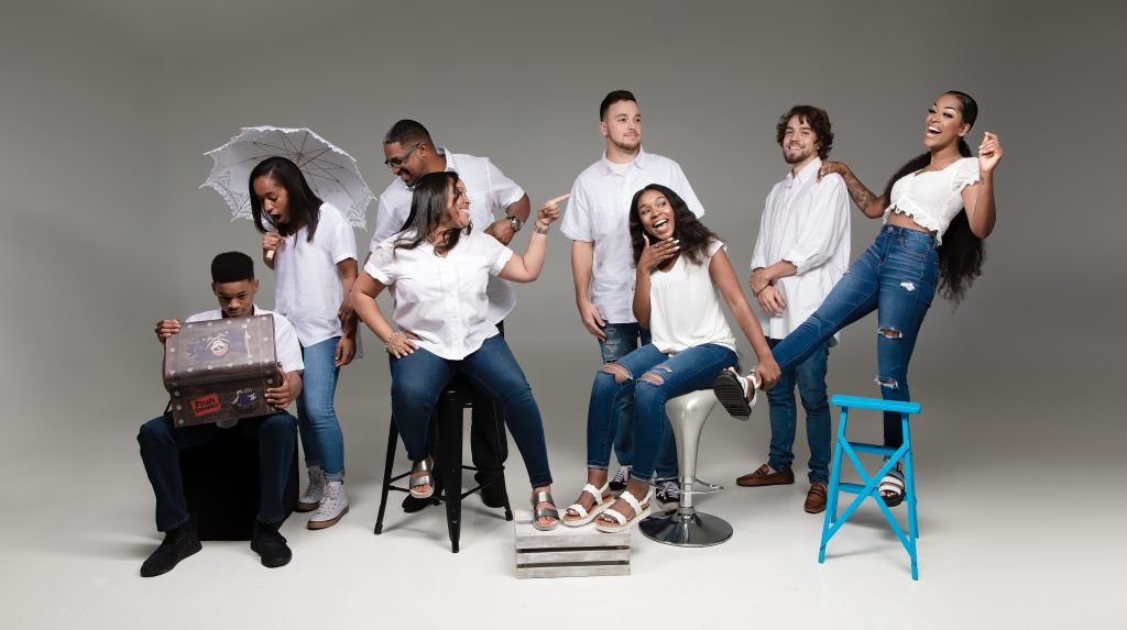Family of 8 showing their personalities in a photo