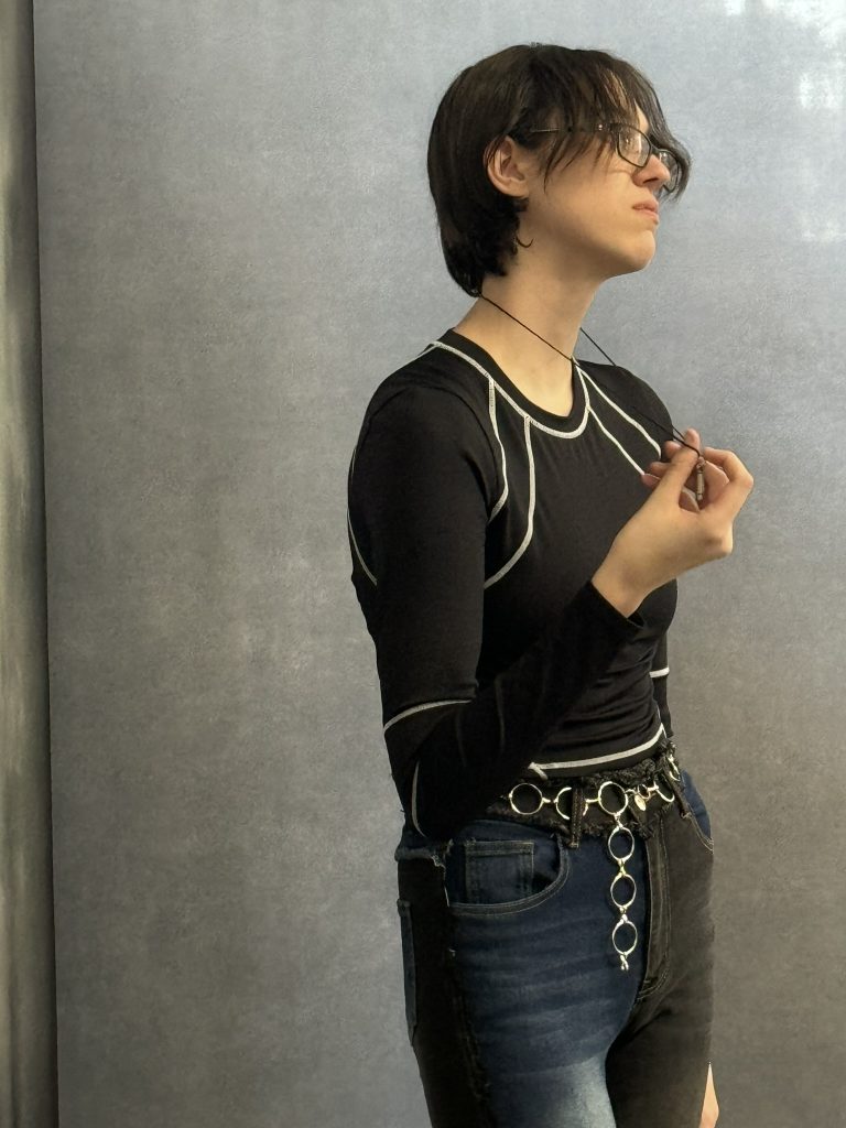 BTS photo of a young female posing at a photoshoot