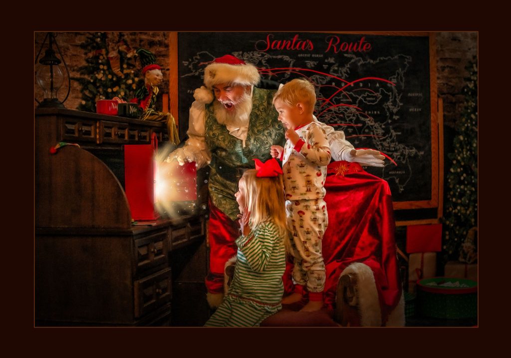 boy and girl experiencing Santa's magic by Longieliere Photography