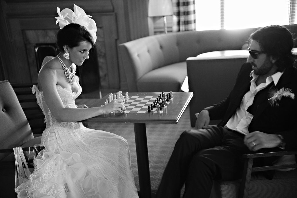 bride and groom playing chess by Longieliere Photography