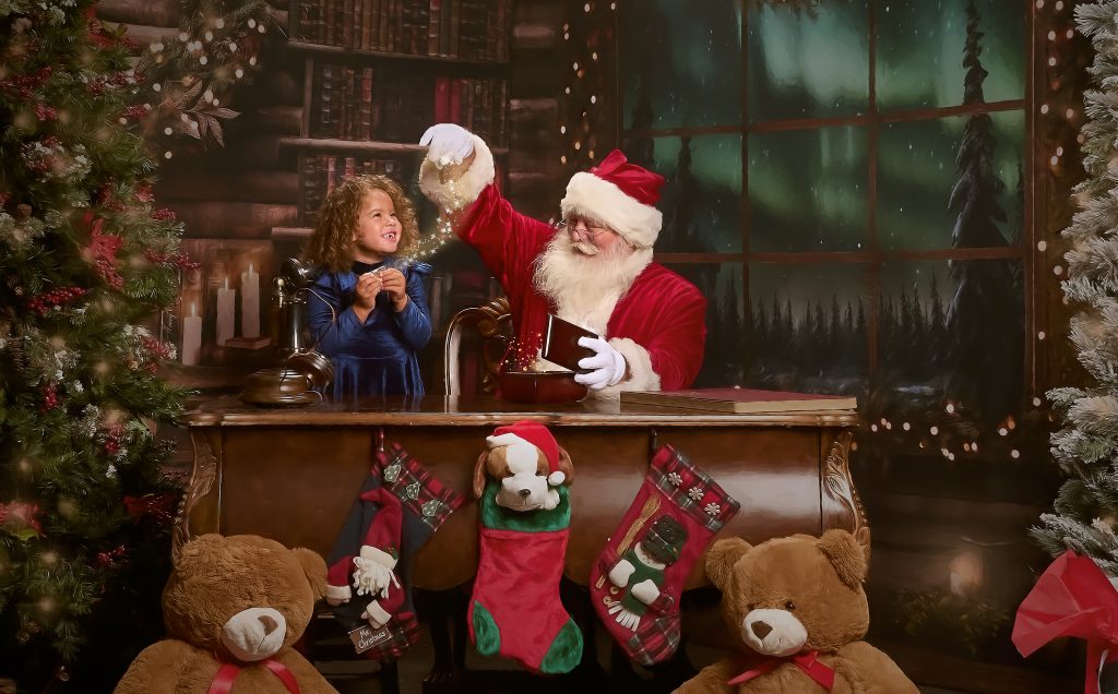 Santa sprinkling magic on little girls magic coin