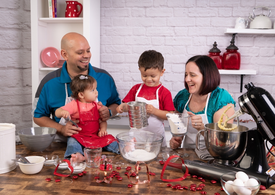 family in kitchen baking for photoshoot