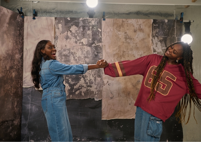 two sisters playing during a photoshoot demonstrating lighting setup