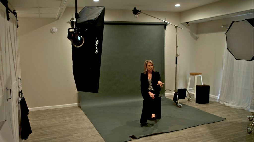 Wall mounted backdrop system keeping a photography studio clean and organized