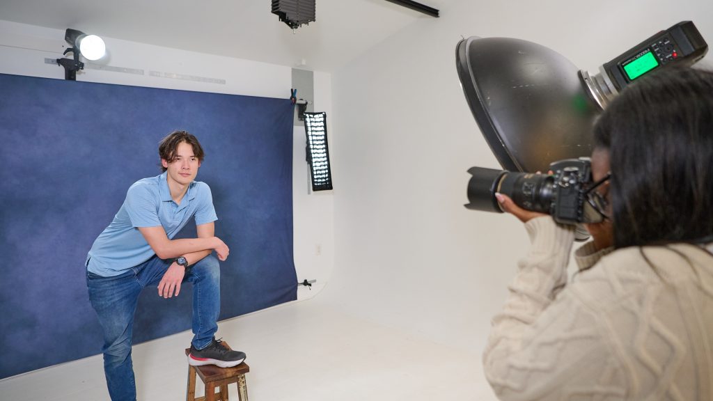 photographer working in studio with efficient backdrop workflow system