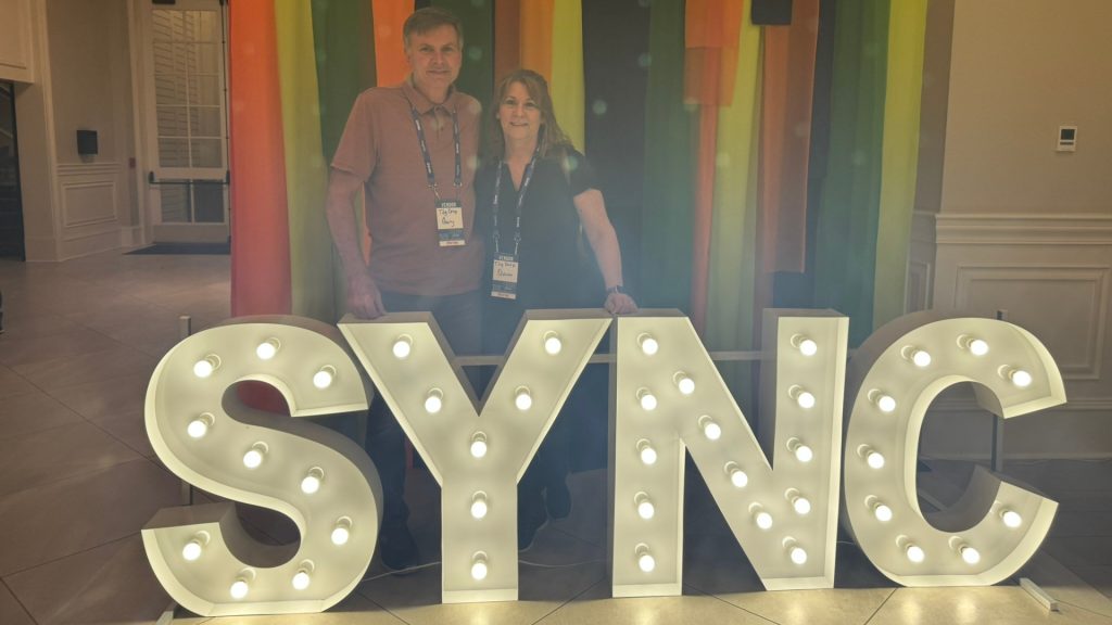 Gary and Elaine at Sync 2026 sign in Destin, Fl after photography conference on studio systems