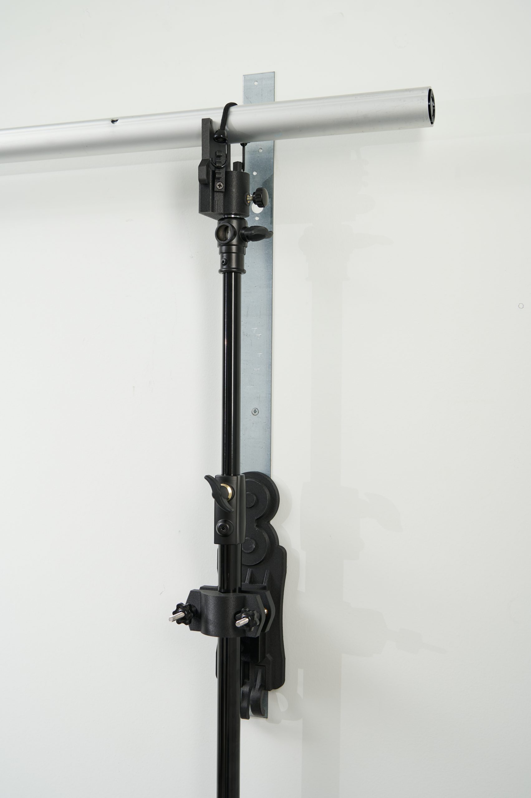 StandFree adjustable extension rods and mounting system connected to vertical inline base