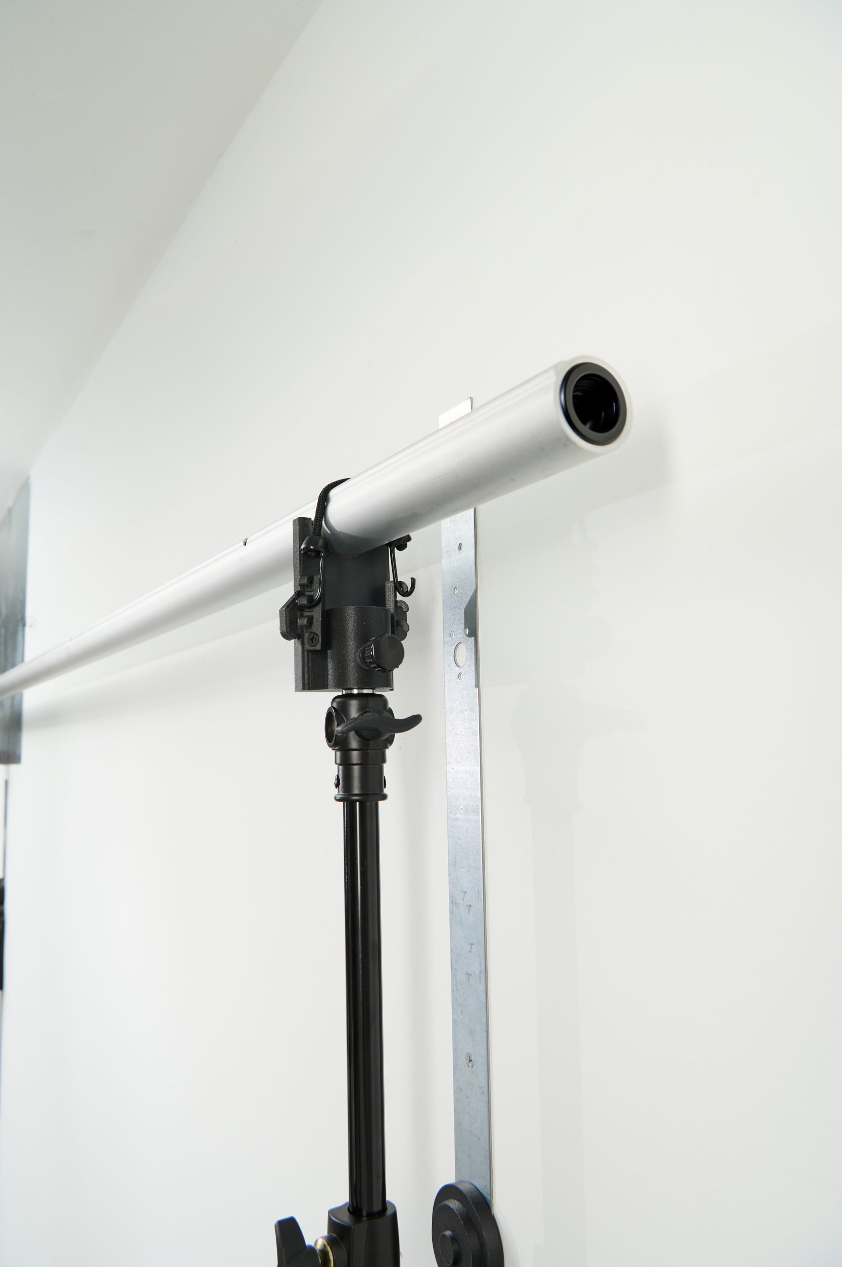 Closer view of the StandFree adjustable extension rods and mounting system connected to vertical inline base
