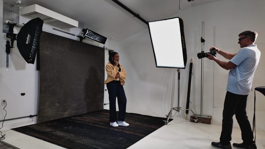 photographer shooting single backdrop with togdrop system, clean studio setup, no floor stands, efficient workflow