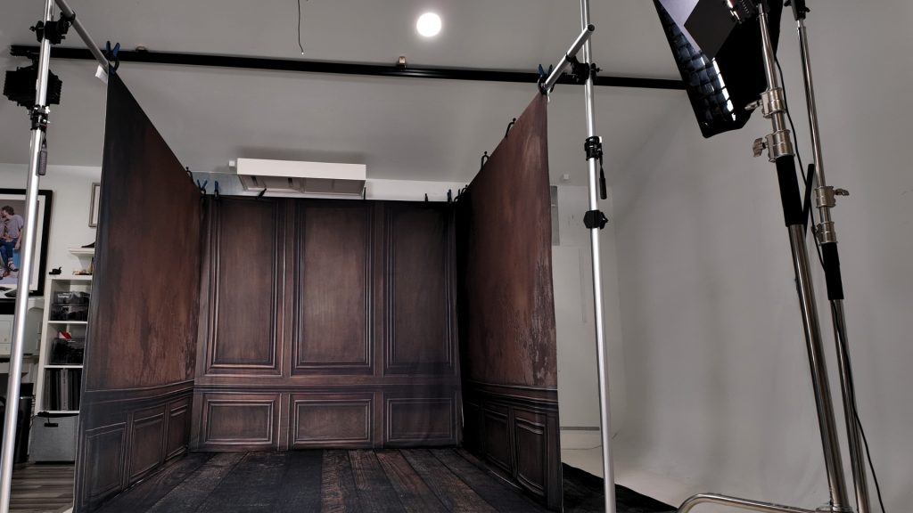 three wall backdrop room setup with togdrop system, corner studio configuration, ready for client session, organized studio space