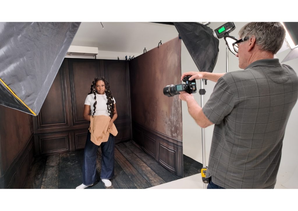 photographer using togdrop system in three wall backdrop setup with client, studio system workflow, corner backdrop room, space saving studio