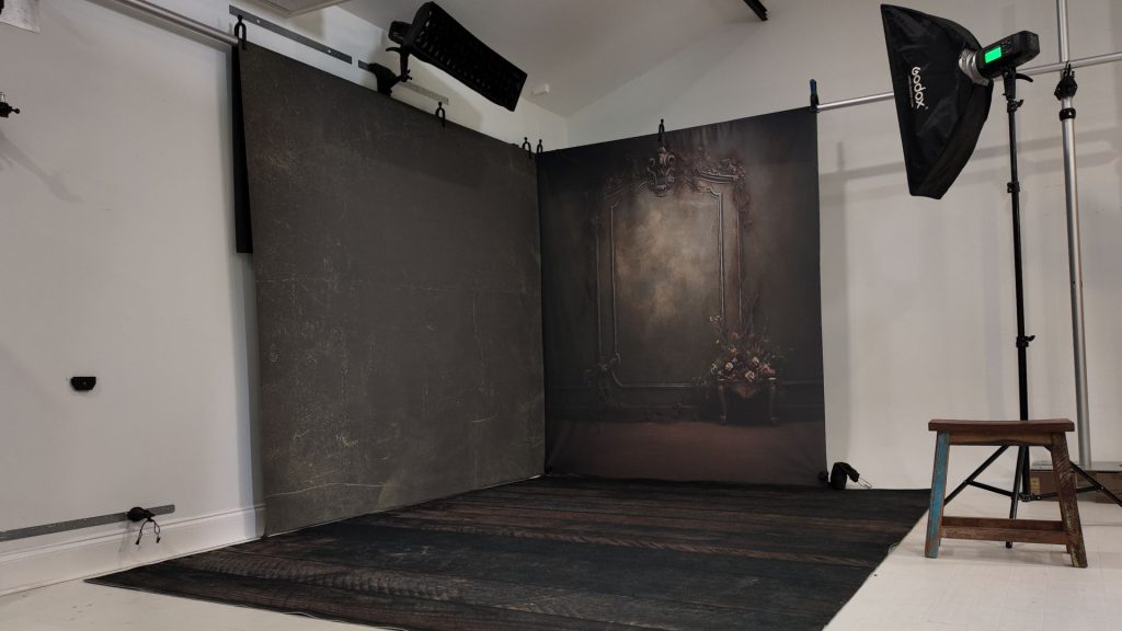 Professional photography studio setup using TogDrop metal wall system and pole system for organized workflow