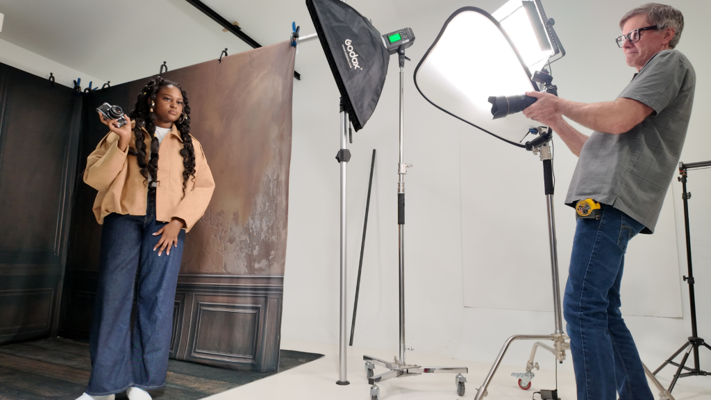 photographer working with client in clean organized studio setup