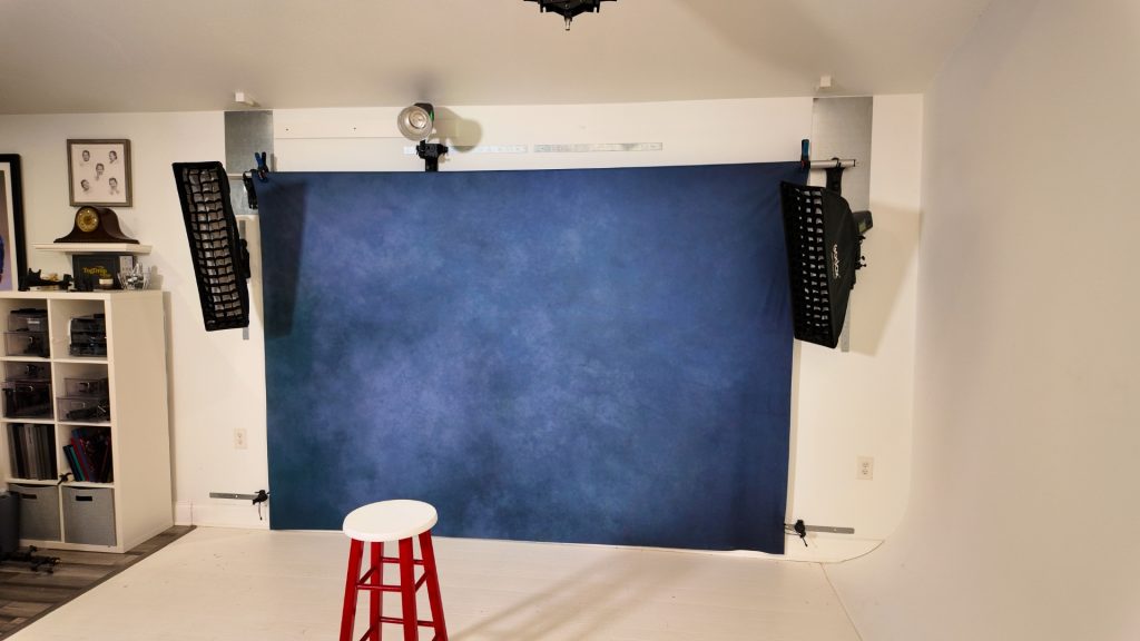 photographer quickly resetting backdrop using modular system