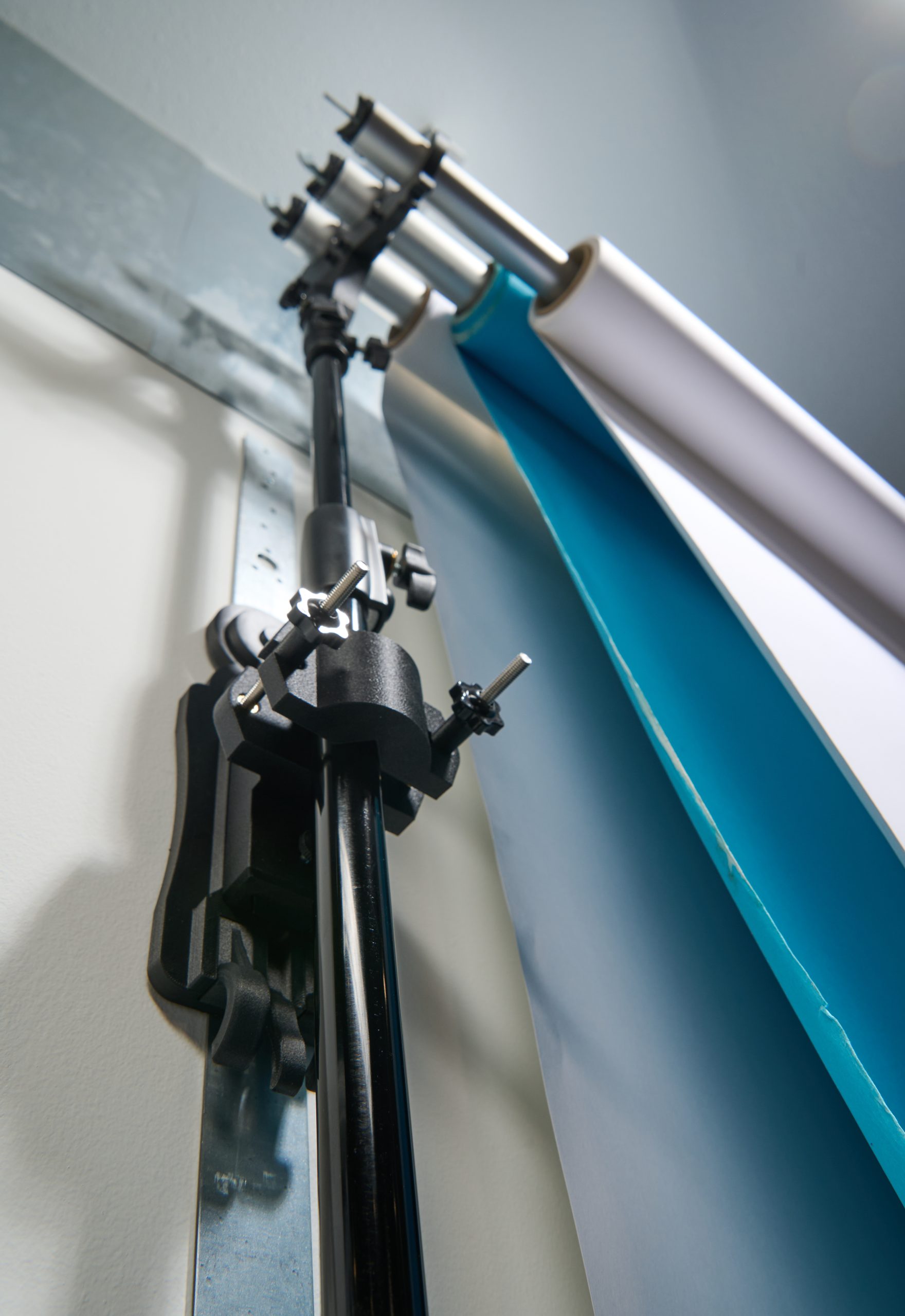 StandFree triple backdrop holder demonstrating strength and durability holding multiple paper backdrops