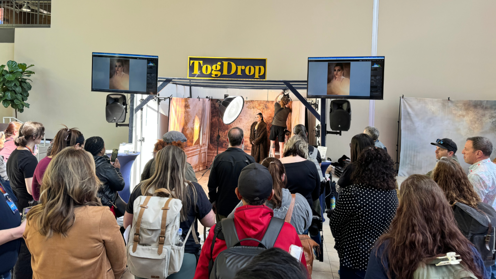photographers gathered at shutterfest booth discussing studio setups