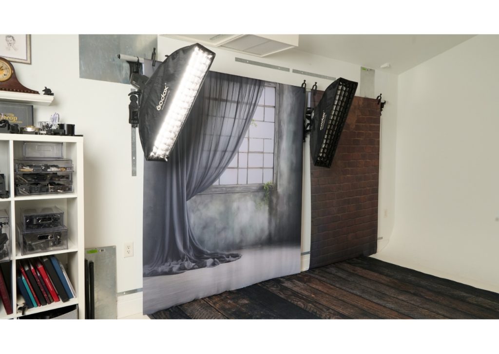 two clean backdrops side by side in organized photography studio