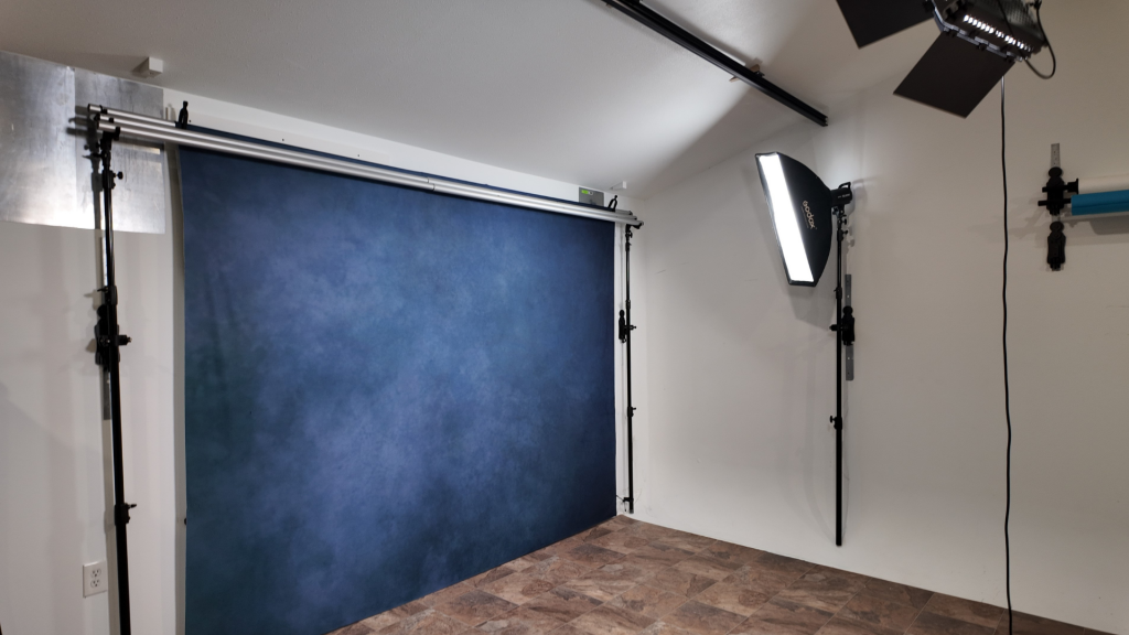 Organized photography studio using a TogDrop backdrop system for efficient workflow in a small studio space