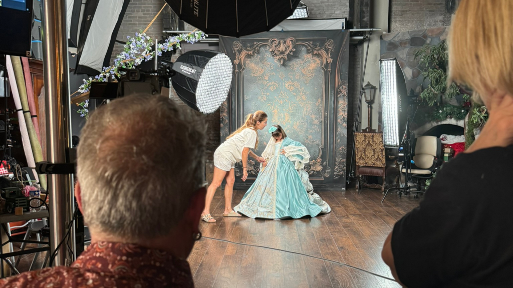Professional photography studio using a TogDrop backdrop system during a live portrait session with organized shooting space.